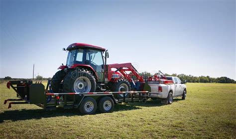 Texas Farming: Delivering/towing a Large Red Tractor. Stock Photo ...