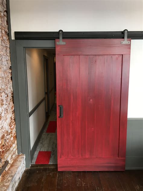 Unique red barn door with industrial hardware. Built in Charleston, SC ...