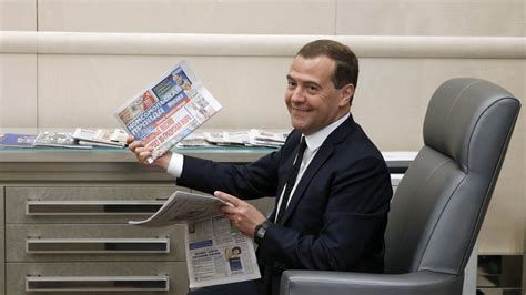 File:Dmitry Medvedev holding newspaper, May 2014.jpg - Wikimedia Commons