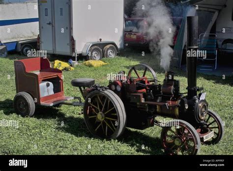 Miniature working model steam engine with trailer Stock Photo - Alamy