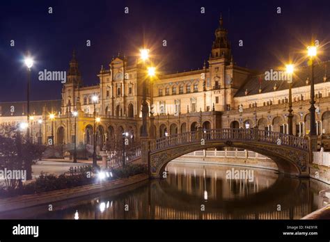 night view of Plaza de Espana with bridges. Seville, Spain Stock Photo ...