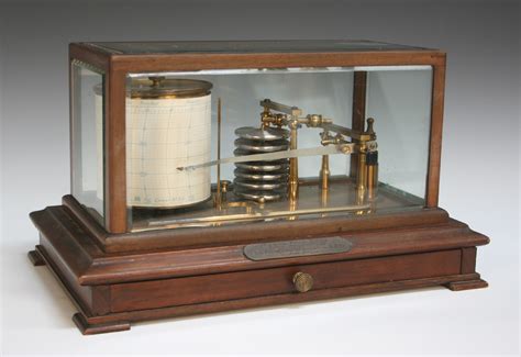 An early 20th Century mahogany cased barograph with lacquered brass mechanism and clockwork recordin