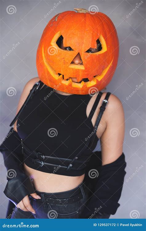 Woman with Carved Pumpkin on Her Head for Halloween Stock Photo - Image of secret, horror: 129537172