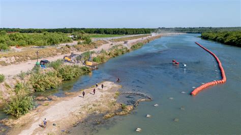 Biden administration sues Texas over anti-migrant river buoys