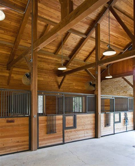 i like the overhead lighting horse barn lighting ideas | Found on texastimberframes.com | Horse ...