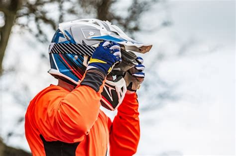 Premium Photo | Rider wears a protective helmet