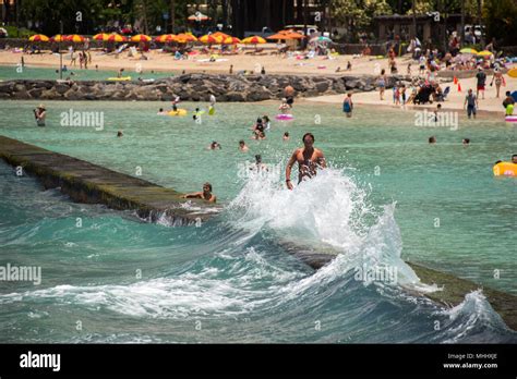 HONOLULU, USA - People having fun at waikiki beach in Hawaii Oahu ...