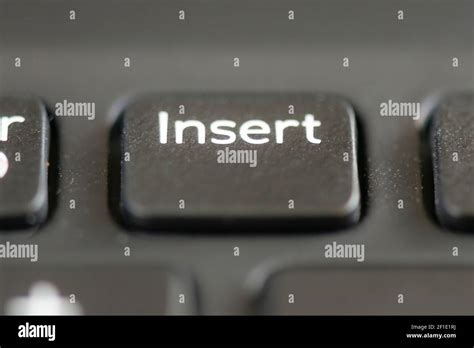 Insert key on a laptop keyboard Stock Photo - Alamy