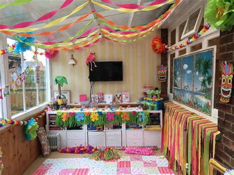 a room filled with lots of decorations and colorful streamers hanging from the ceiling above it