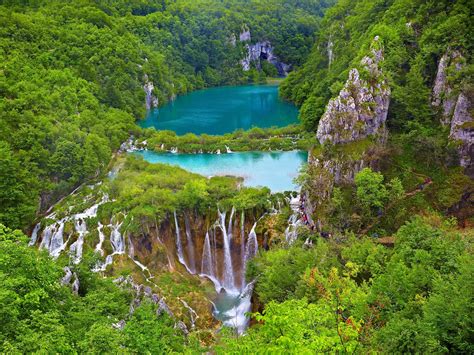 Walk through Croatia's Plitvice Lakes, a UNESCO World Heritage Site with stunning lakes, caves ...