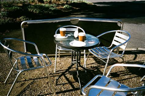 Table, chairs and disposable coffee cups | Photographed usin… | Flickr