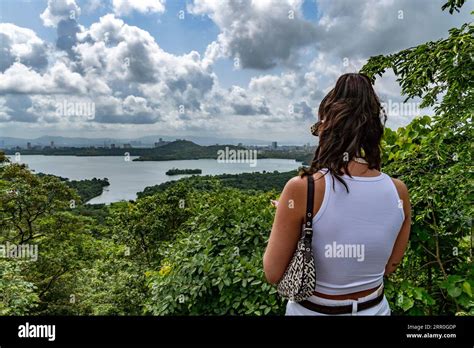 A tourist stands on a hill overlooking the city in Goregaon Film City ...