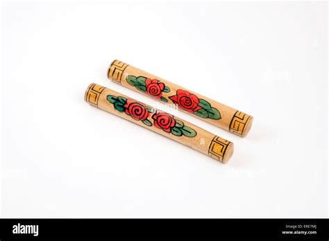 Claves, (decorated) percussion instrument Stock Photo - Alamy