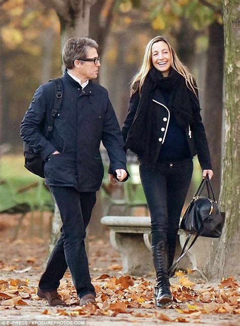 Hugh Grant accompanies pregnant Anna Eberstein on a stroll in Paris