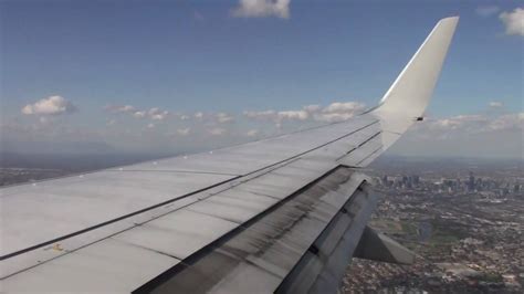 Wing View Boeing 737-800 Qantas QF619 Landing Melbourne Tullamarine 17APR10 from BNE - YouTube