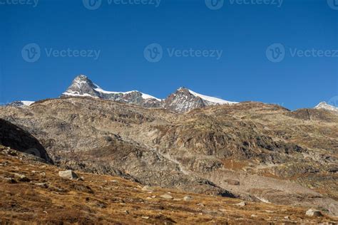 hiking in the swiss alps 12959114 Stock Photo at Vecteezy