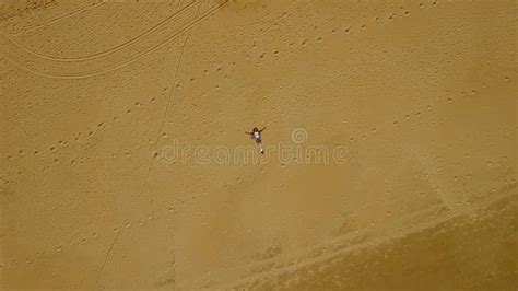 View from Above of Woman Laying in Sand Stock Footage - Video of sand, beach: 72558054