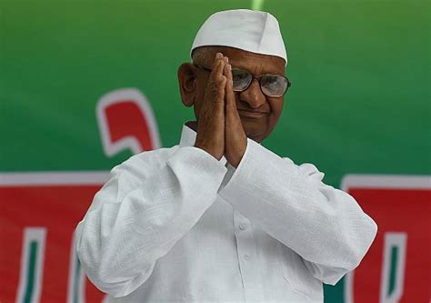 Indian anti-corruption activist Anna Hazare gestures as he arrives at a protest against a land ...