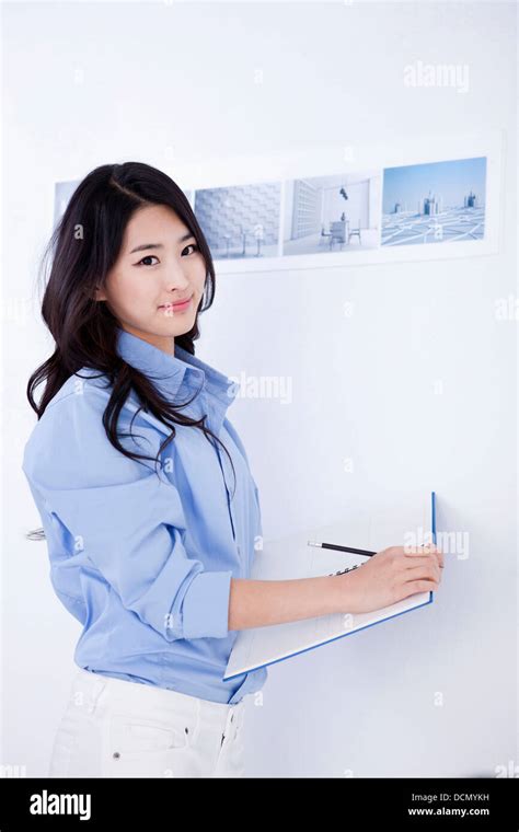 an interior designer with a sketch book Stock Photo - Alamy