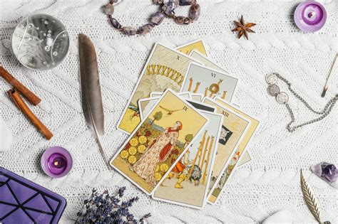 Premium Photo | Tarot cards spread face up on white knitted surface ...