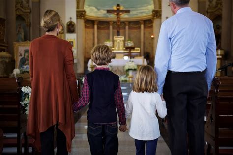 Premium Photo | A family praying together inside a church