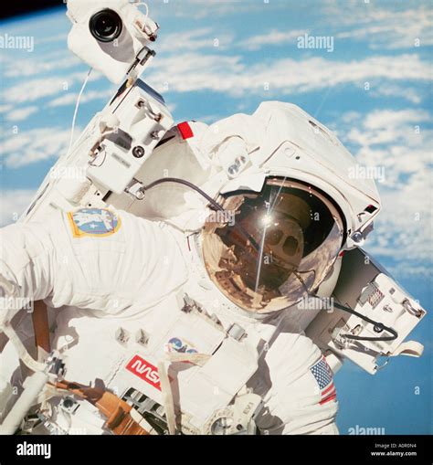 NASA Astronaut. Space walk in Earth's orbit using manned maneuvering unit Stock Photo - Alamy