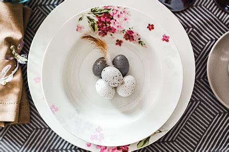 Royalty-Free photo: Round dinner table decorated with easter motifs ...