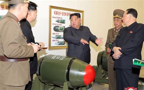 Kim Jong-un unveils new nuclear warheads that can strike neighbours for ...