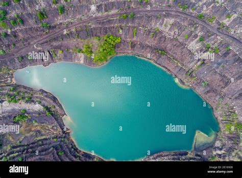 Aerial view, deep mine lake in place of a mining pit Stock Photo - Alamy