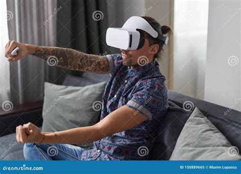 Man playing VR racing game stock image. Image of comfort - 150889665