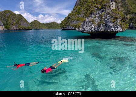 Snorkeling in Wayag Island Raja Ampat Indonesia Stock Photo - Alamy