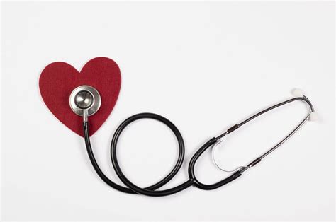 Traditional stethoscope with a red heart on white background - Creative ...