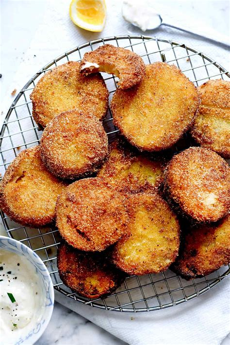 With a crispy golden flour and cornmeal crust, these fried green ...