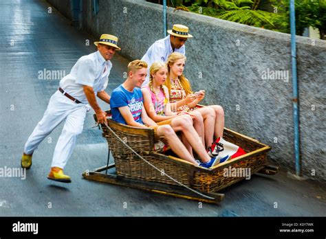 Toboggan ride going down in Monte Stock Photo - Alamy