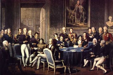 a group of people sitting around a table in front of a painting on the wall