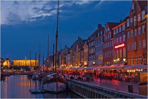 When night falls in Nyhavn | Copenhagen, Travel, New york skyline