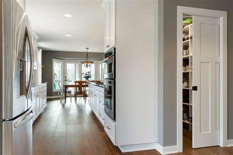 Corridor Kitchen That's Filled with Natural Light - Dura Supreme Cabinetry