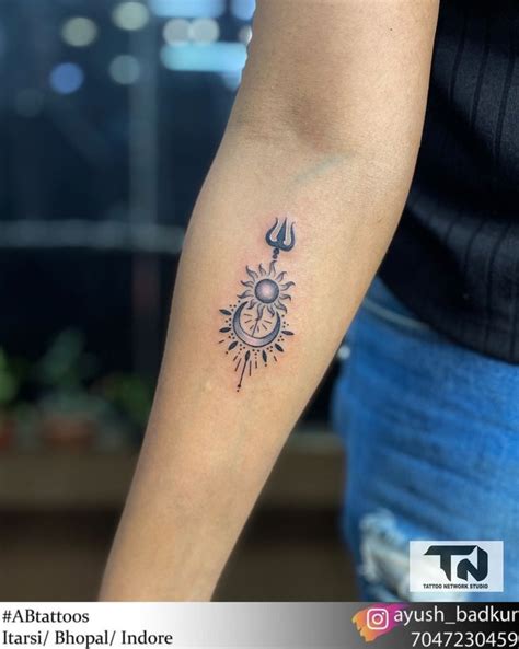 sun and moon tattoo with trisul | Tattoo designs wrist, Tattoos for ...