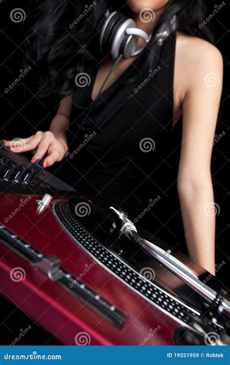 Female DJ Mixing On Turntables Royalty Free Stock Images - Image: 19551959