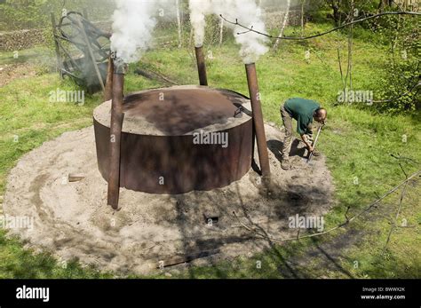 Charcoal burning charcoal burner with burning Stock Photo - Alamy