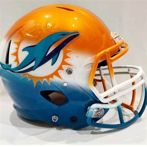 a miami dolphins football helmet is shown on a white background with ...