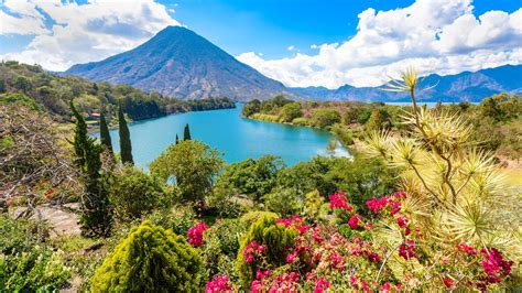 Bay of Lake Atitlán with view to Volcano San Pedro in highlands of ...