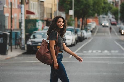 "Pretty Young Woman Walking Across The Street" by Stocksy Contributor ...