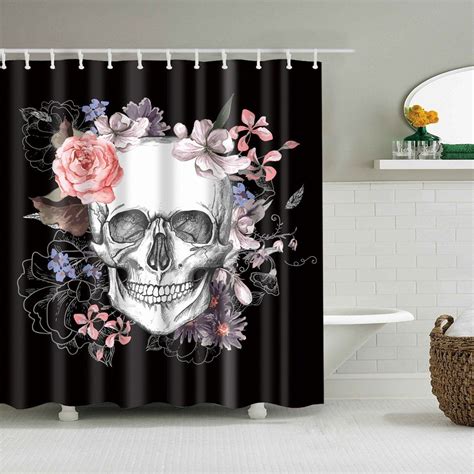 a shower curtain with a skull and flowers on it