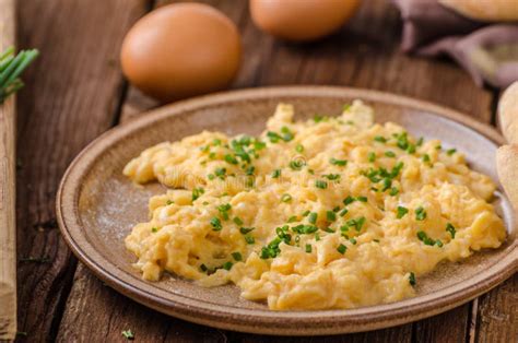 Scrambled eggs with herbs stock image. Image of food - 102884131