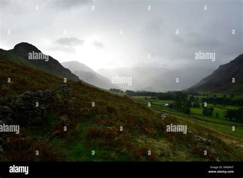 Great langdale valley in heavy rain with sun breaking through hi-res stock photography and ...