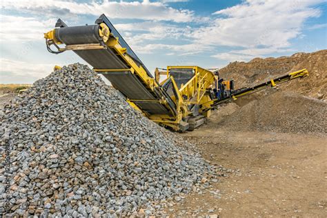 Stone crusher machine in a quarry or open-pit mine, to transform into ...