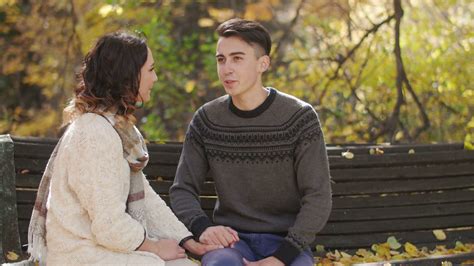 Boy Girl Sitting On Bench Talking Stock Footage SBV-304450534 - Storyblocks