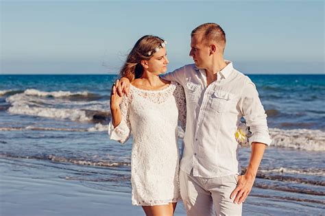 Royalty-Free photo: Couple Looking at Each Other Beside Beach | PickPik