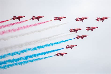 Red Arrows Hawk T1 Jets Flying in Formation Leaving Behind Colorful ...